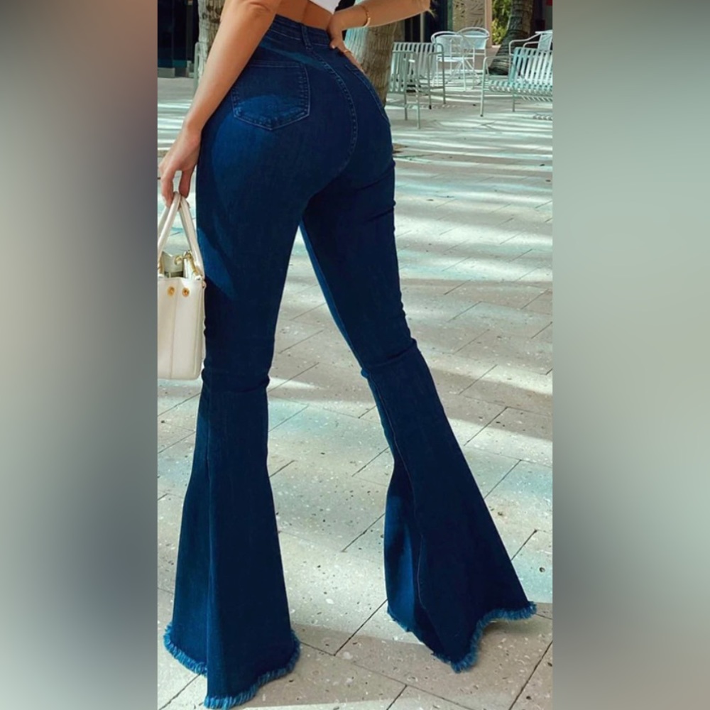 PrettyLittleThing Indigo Raw Hem Extreme Bell Flare Jeans